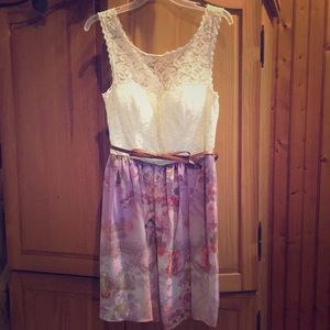 Beautiful purple floral dress with brown bow belt.